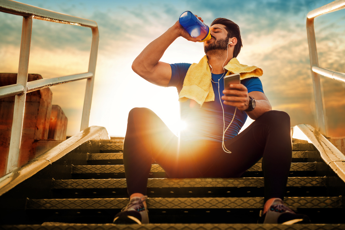 Young Athlete Man Drinking Protein Cocktail